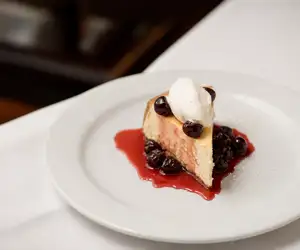 Cheesecake with fresh berry sauce.